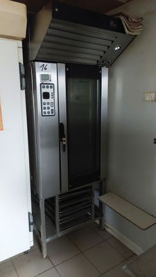 a metal door that is open in a room