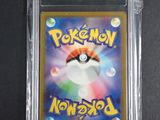 a close up of a pokemon card in a plastic case