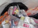 a plastic bag full of toothbrushes, toothpaste, toothpaste, toothpaste, toothpaste, toothpaste, and