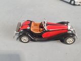 two toy cars that are sitting on a table