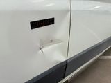 a close up of a car door with a sticker on it
