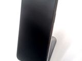 a cell phone that is sitting on top of a stand