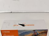 the box is empty on the table with a mountain bike in it