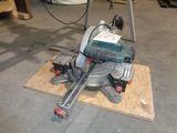 a machine that is sitting on a piece of wood