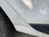 a close up of a car ' s tire on the ground