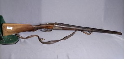 an old rifle with a wooden handle and a leather case