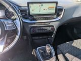 the interior of a car with a steering wheel, dashboard, and dashboard controls