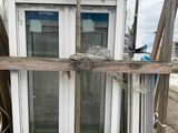 a wooden pallet with a window and a door on top of it