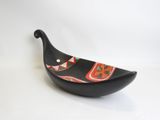 an image of a black bowl with a red and orange design