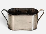 an old metal cup holder with two handles on a white background