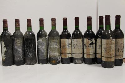 several bottles of wine are lined up in a row