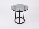 a black side table with a glass top on a white background