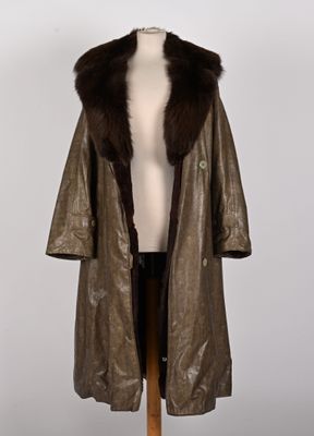 an image of a brown leather coat with a fur collar on a mannequin