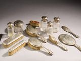 a lot of silver and glass items on the table