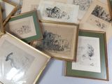 many framed pictures of animals on the table