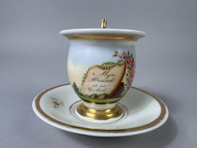 a cup and saucer on a saucer on a saucer