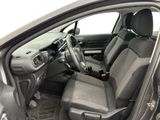 the interior of a car with the door open showing the driver ' s seat