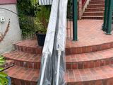 an image of a patio with a umbrella on the steps