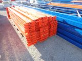 orange and blue steel beams stacked on top of each other