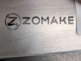 a close up of a person ' s hand holding a zomake knife