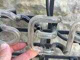 a person that is holding a plastic object in front of a bike