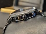 a watch that is sitting on top of a watch case