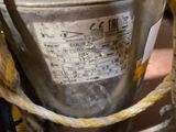 a close up of a metal bucket with a rope around it