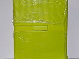 a yellow suitcase that is wrapped in plastic