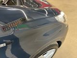 a close up of a car with a sticker on it ' s hood