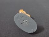 a close up of a pill on a black surface