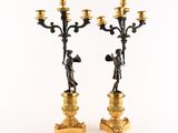 pair of antique brass candelabs with figures on them