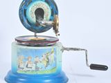 a blue and white music box with a picture on it