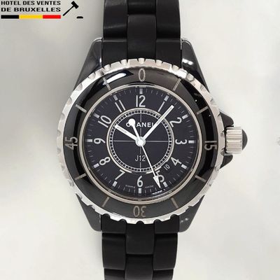 the watch is black and has a black dial