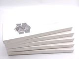several white books with a picture of a car on them