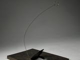 an image of a sculpture of a bird flying through the air