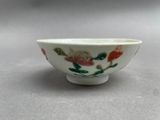 an image of a small bowl with flowers painted on it