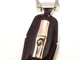 a leather key case with a metal clasp on it