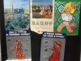 three posters on the door of a building with pictures on them