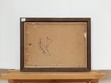 an old picture frame sitting on top of a wooden table