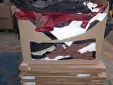 a cardboard box with a bunch of clothes in it