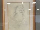framed drawing of a man with a beard in a frame