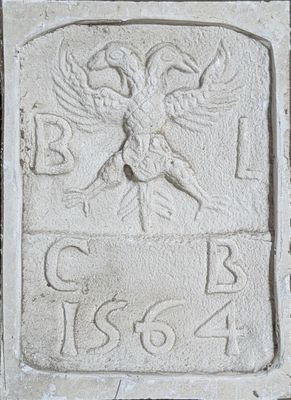 an image of a stone plaque with a bird on it