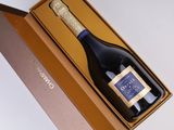 an open box with a bottle of wine inside of it