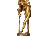 une image représentant la statue d'un homme tenant un bâton