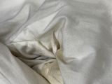 an image of a bed with white sheets and a pillow