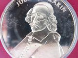 the back of a silver coin with a picture of a man on it
