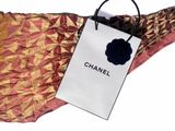 a bag with a flower on it hanging from a hanger