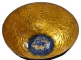 a yellow ball with a blue center on a black stand