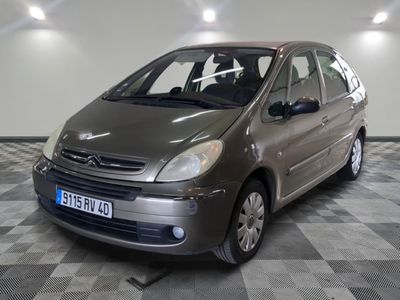 a picture of a small car parked in a garage
