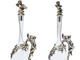 pair of silver and glass vases with birds on them